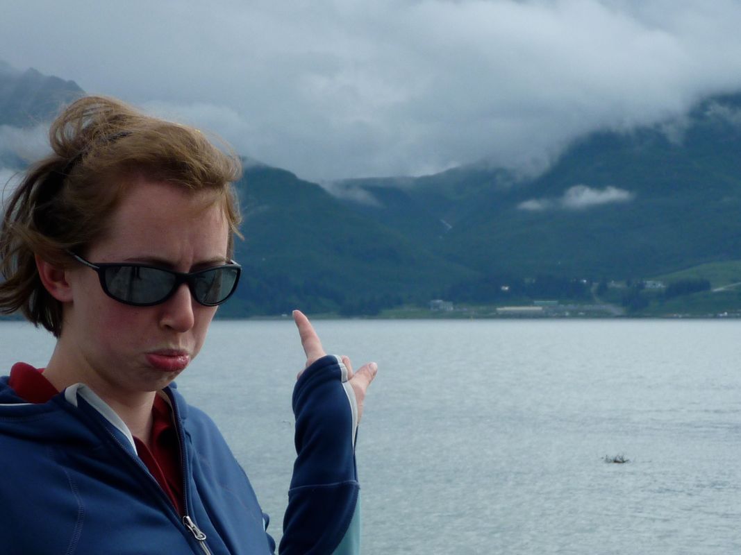 Megan pointing to fogged-in Allison Lake