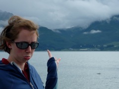 Megan pointing to fogged-in Allison Lake